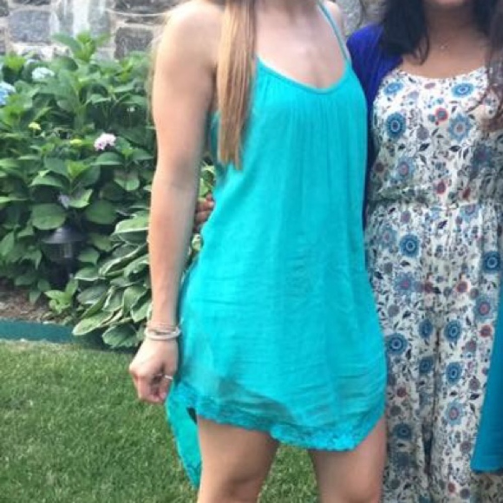 Plain turquoise dress with detailing at bottom